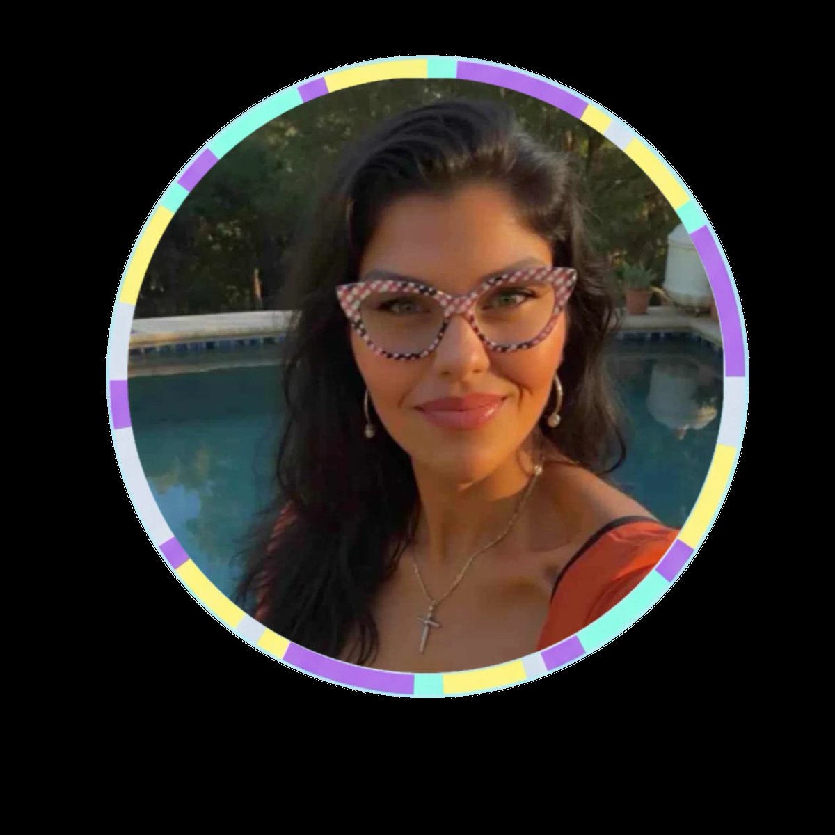 Woman wearing patterned sunglasses by a pool, smiling at camera with long dark hair