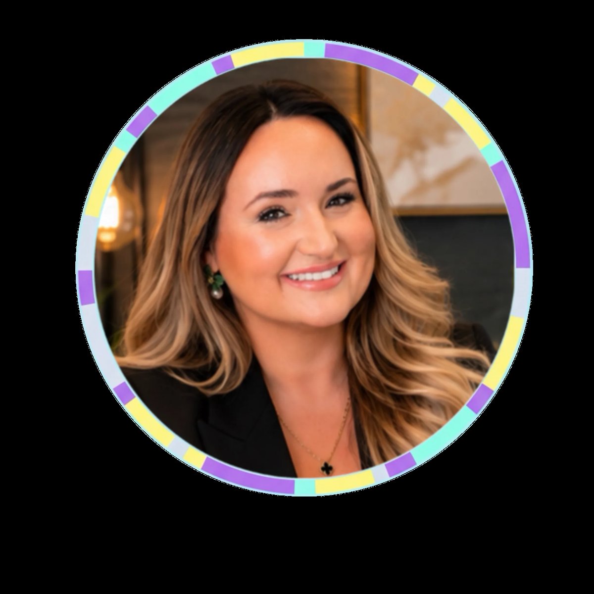 Professional headshot of a smiling woman with long brunette hair wearing a black blazer and earrings, circular frame with rainbow border